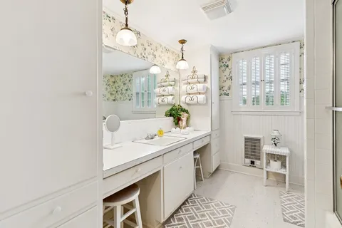 a kitchen with a sink cabinets and window