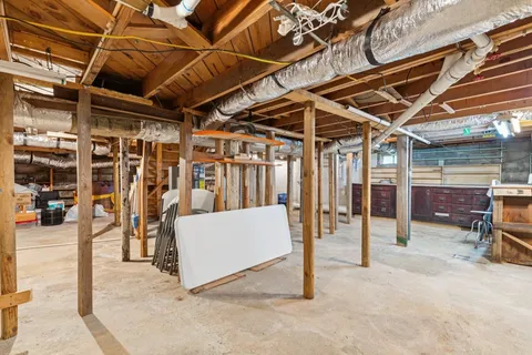 a view of a room with wooden ceiling
