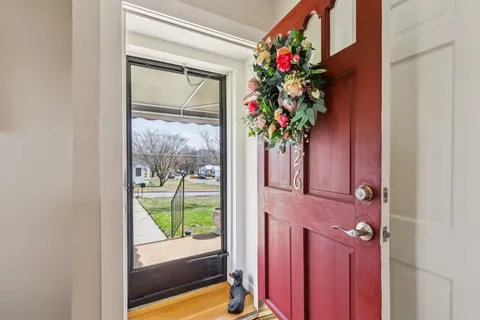 a house that has a flower in front of it
