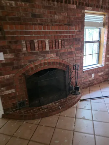a view of a ceiling fan and a window