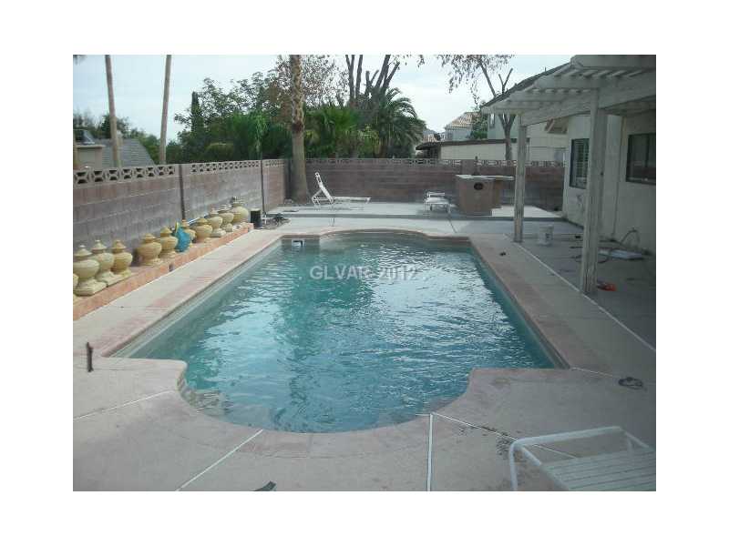 1802 Nuevo Road Henderson, NV 89014 - Photo 2 of 12 Yard/Garden. SPARKLING SELF CLEANING POOL WITH PEBBLE TEC