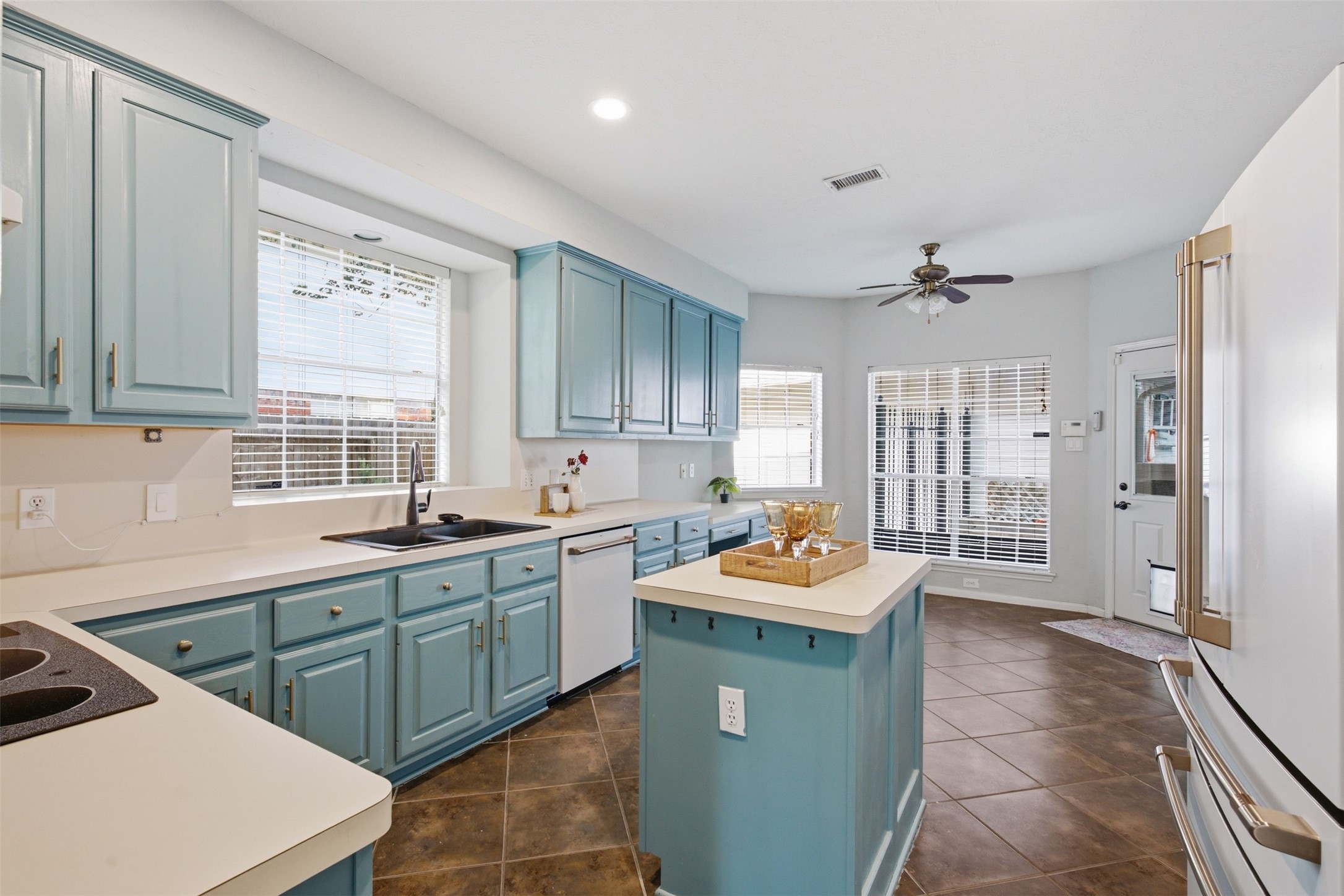 323 Magic Oaks Court Spring, TX 77388 - Photo 11 of 49 Kitchen features a convenient kitchen island and stylish cabinets with ample storage.