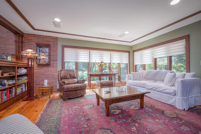 a kitchen with stainless steel appliances granite countertop a stove top oven a sink and white cabinets
