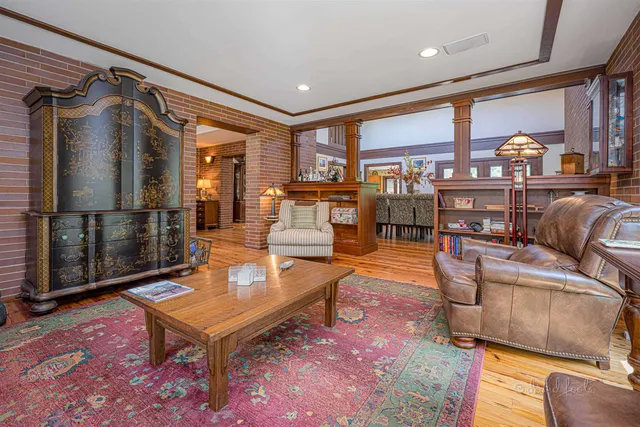 a kitchen with stainless steel appliances granite countertop a stove top oven a sink dishwasher and cabinets with wooden floor