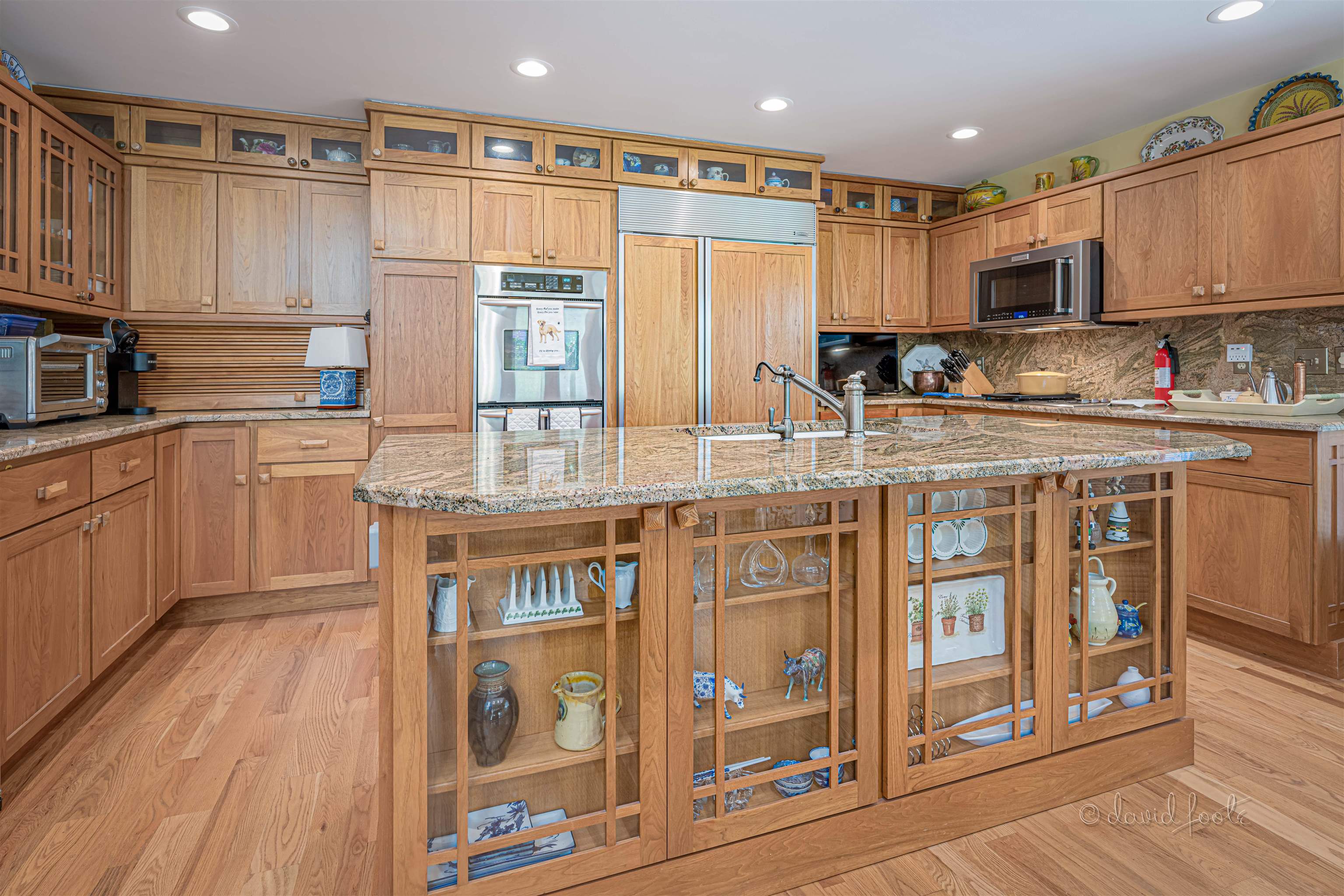 49 High Ridge Run Galena, IL 61036 - Photo 25 of 81 a kitchen with stainless steel appliances granite countertop a stove top oven a sink and white cabinets