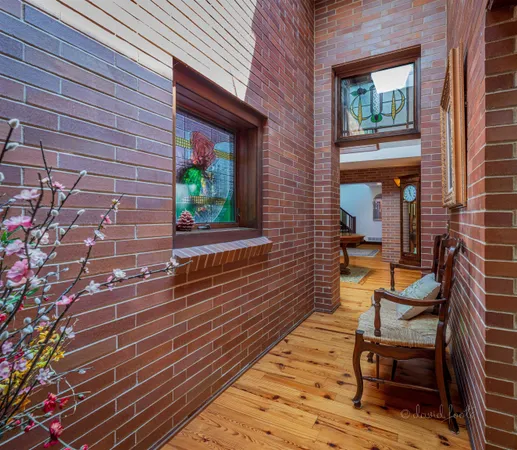 a living room with furniture and floor to ceiling windows
