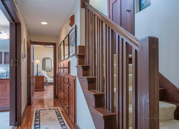 a view of entryway and hall with wooden floor
