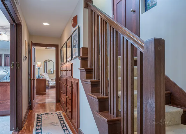 a view of entryway and hall with wooden floor