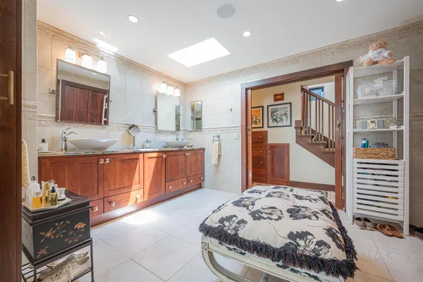 a kitchen with cabinets and chairs