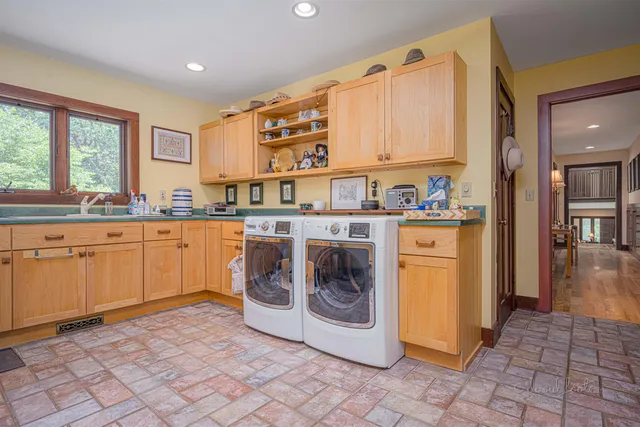 a view of a house with backyard sitting area and garden