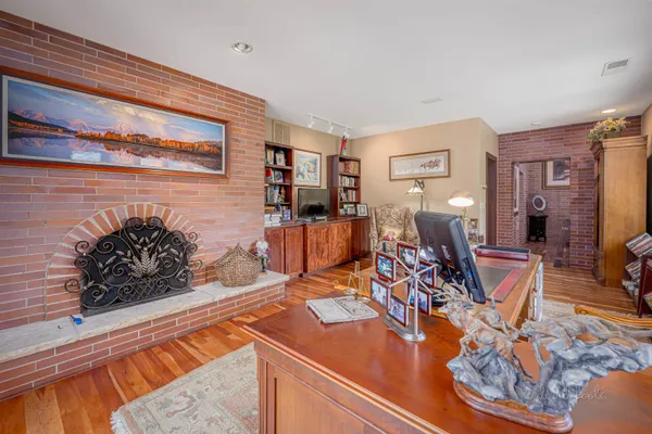 an aerial view of a house with pool garden and mountain view