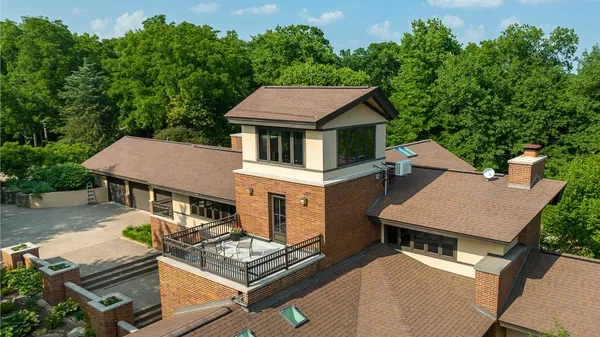 an aerial view of a house with outdoor space and street view