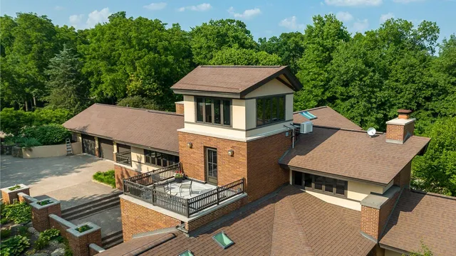 an aerial view of a house with outdoor space and street view