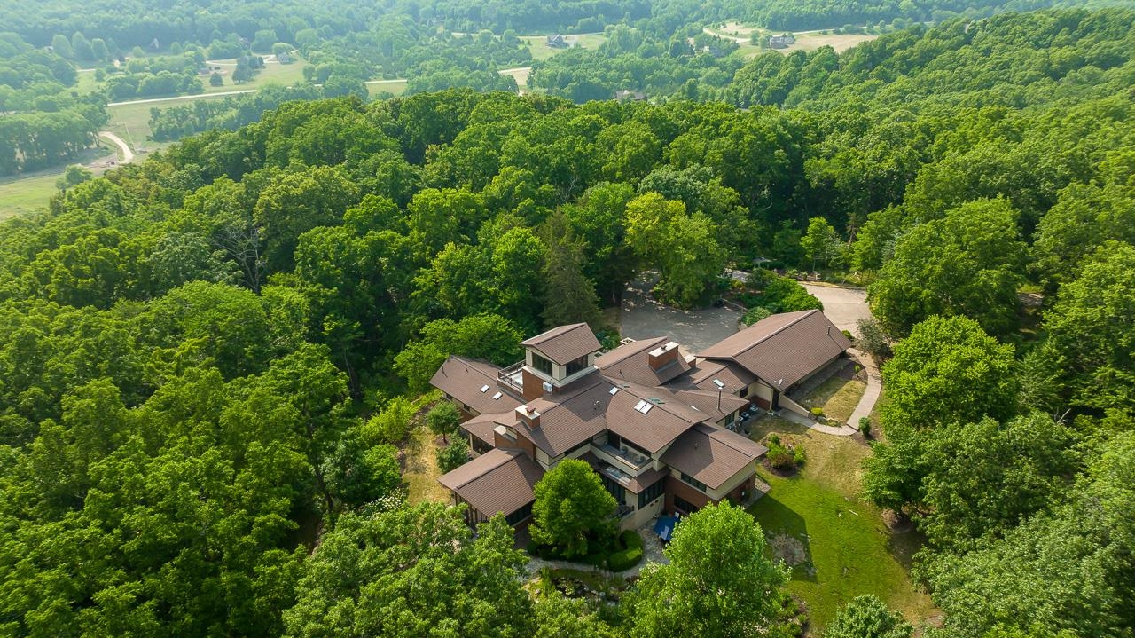 49 High Ridge Run Galena, IL 61036 - Photo 79 of 81 an aerial view of residential house with outdoor space and trees all around