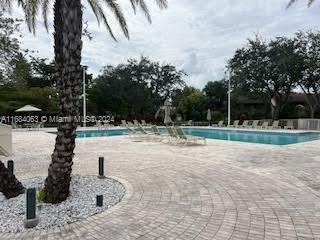 11545 Southwest 109th Road, Unit 25W Miami, FL 33176 - Photo 11 of 16 a view of a park with large trees