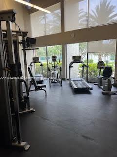 11545 Southwest 109th Road, Unit 25W Miami, FL 33176 - Photo 14 of 16 a gym room with gym equipment