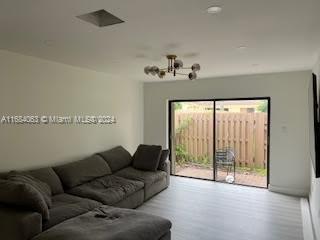 11545 Southwest 109th Road, Unit 25W Miami, FL 33176 - Photo 4 of 16 a living room with furniture and a large window