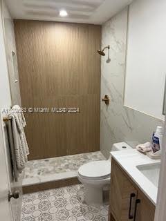 11545 Southwest 109th Road, Unit 25W Miami, FL 33176 - Photo 8 of 16 a bathroom with a sink a toilet and shower