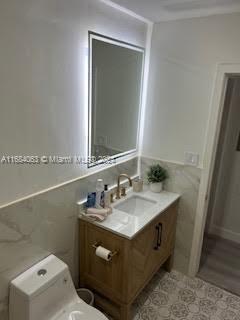 11545 Southwest 109th Road, Unit 25W Miami, FL 33176 - Photo 9 of 16 a bathroom with a sink and a mirror