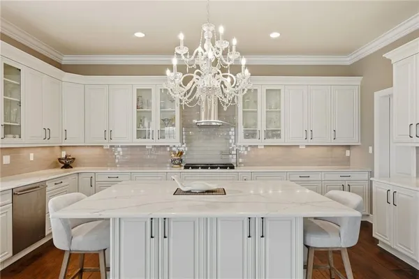 a kitchen with a table and chairs in it