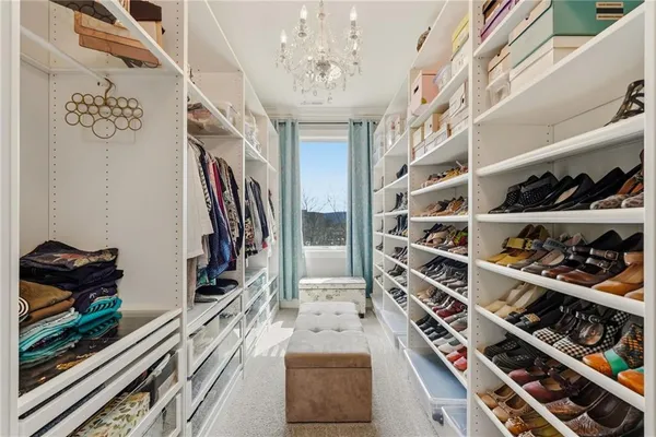 a kitchen with stainless steel appliances cabinets and a window