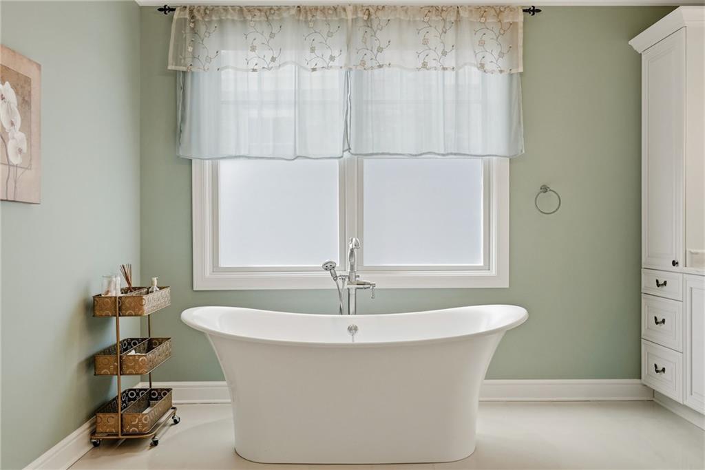 1690 Shelburne Lane Pittsburgh, PA 15217 - Photo 28 of 50 a white bath tub sitting in a bathroom