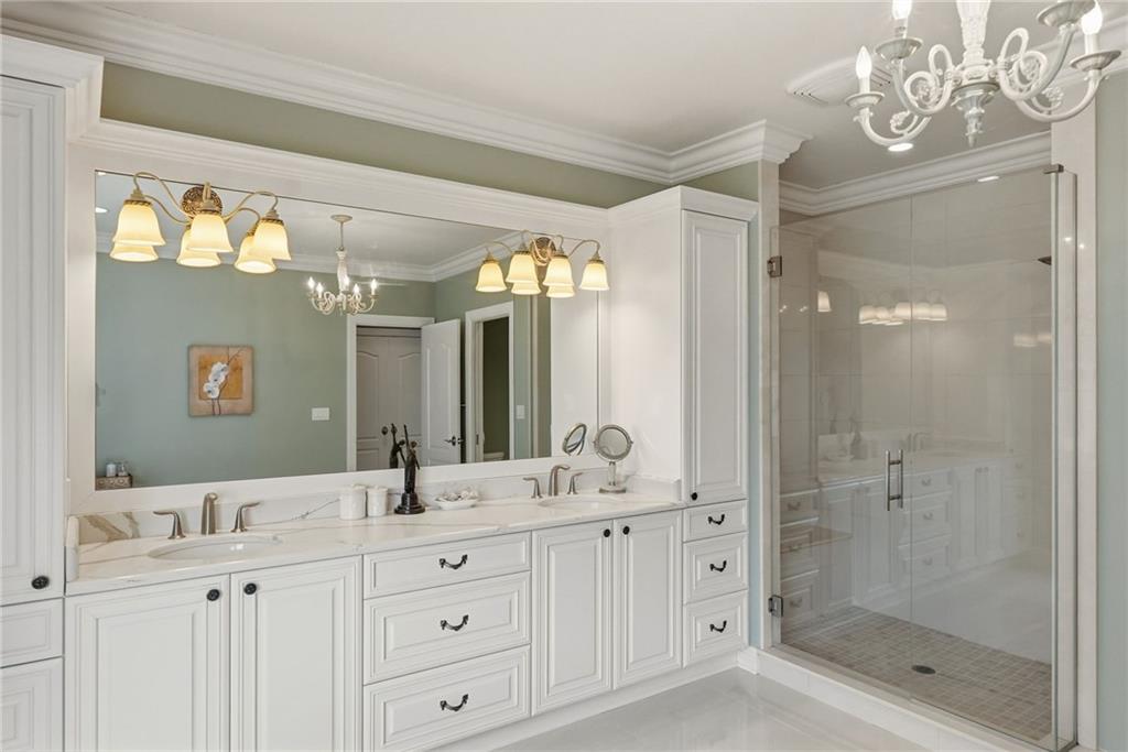 1690 Shelburne Lane Pittsburgh, PA 15217 - Photo 29 of 50 a bathroom with a double vanity sink mirror and shower