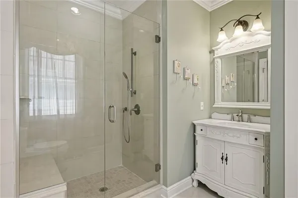 a bedroom with a large bed and a large window