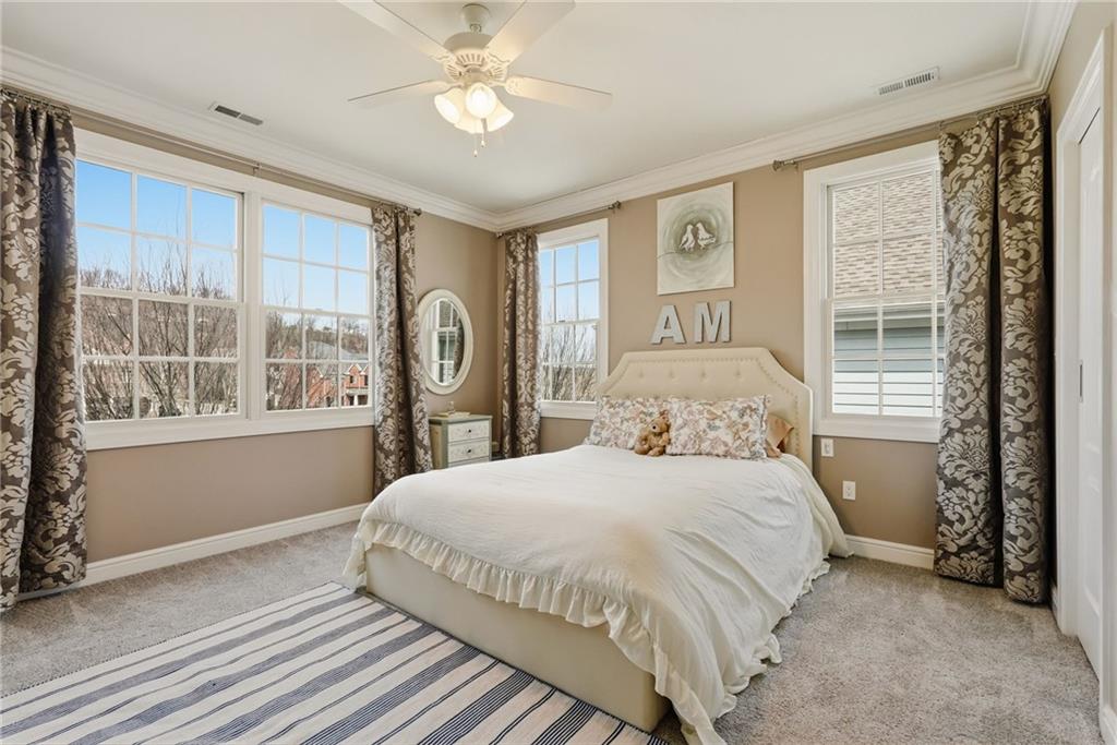 1690 Shelburne Lane Pittsburgh, PA 15217 - Photo 35 of 50 a bedroom with a large bed and a large window