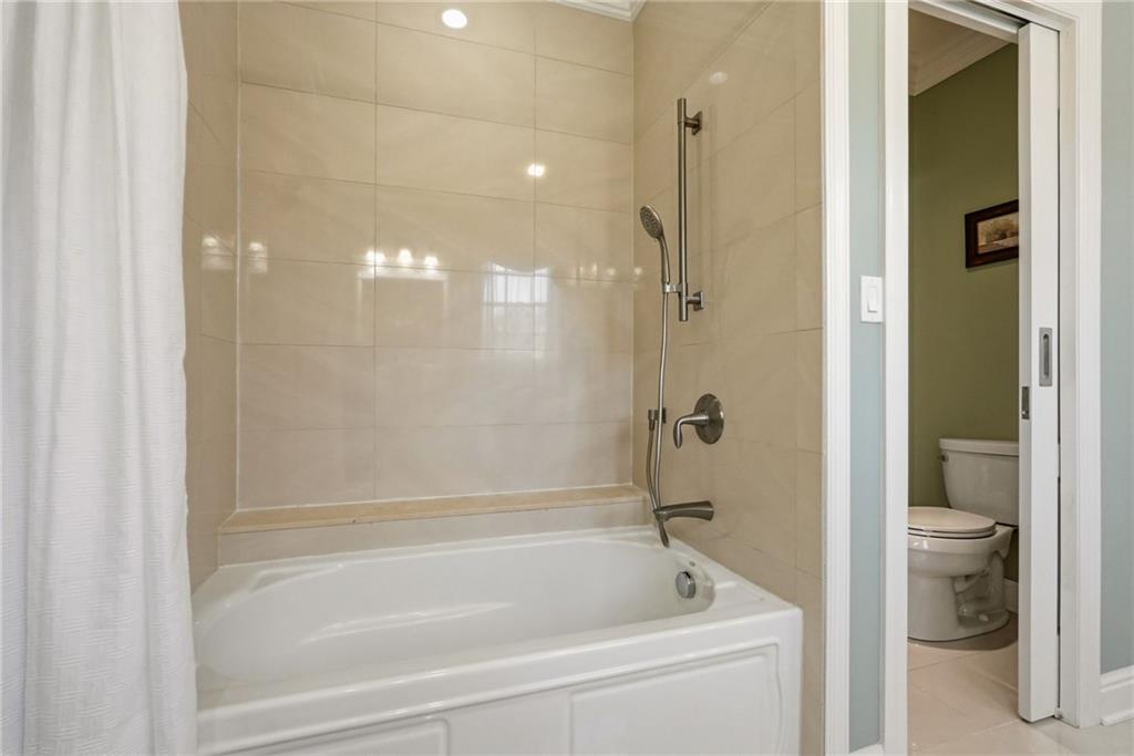 1690 Shelburne Lane Pittsburgh, PA 15217 - Photo 39 of 50 a bathroom with a bathtub and a shower