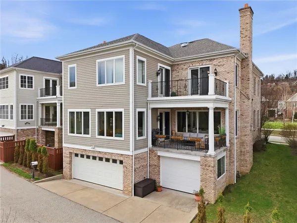 an aerial view of a house with a swimming pool yard and mountain view in back