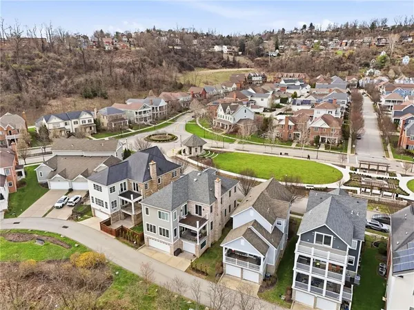 an aerial view of a house with a ocean view