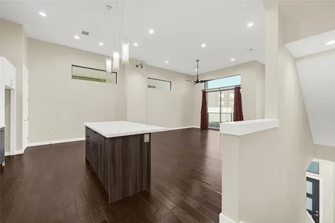 a view of kitchen with wooden floor and window