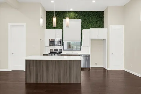 a view of living room with furniture and wooden floor
