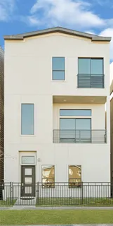 a view of a brick house with a yard