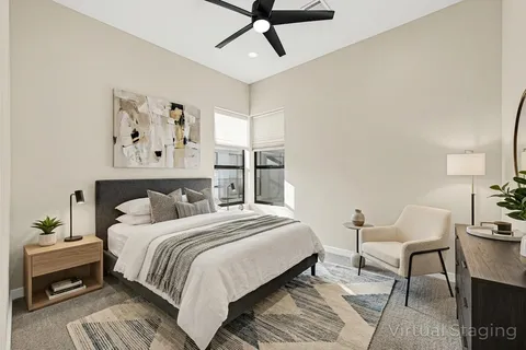 a bedroom with a bed and dresser