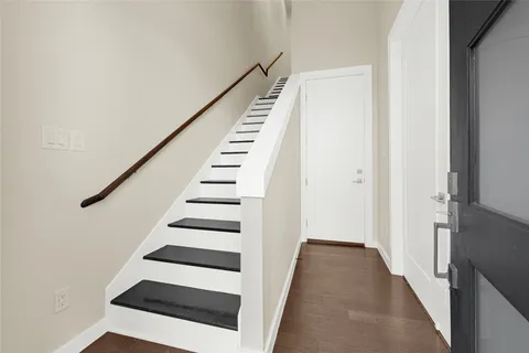 a view of entryway with stairs and white walls
