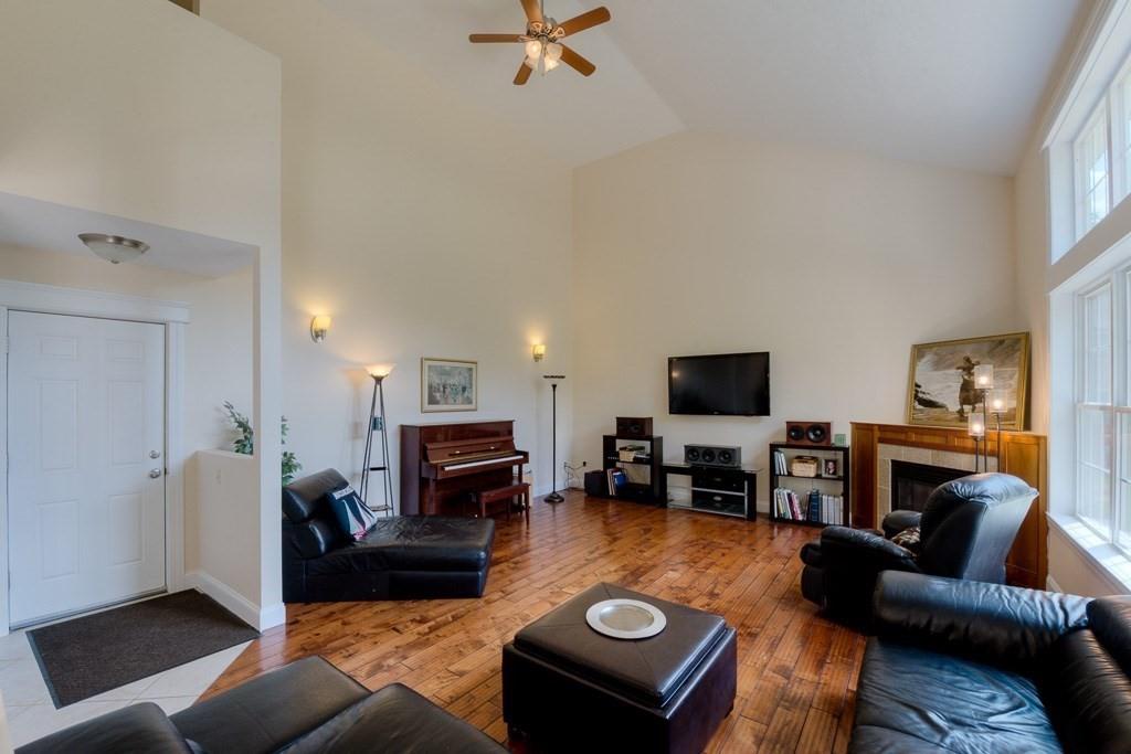 28 Draper Woods Road Sturbridge, MA 01518 - Photo 36 of 41 a living room with furniture and a flat screen tv