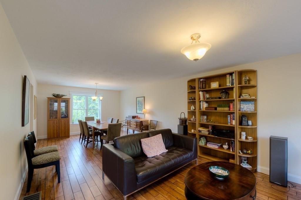 28 Draper Woods Road Sturbridge, MA 01518 - Photo 5 of 41 a living room with furniture and a wooden floor