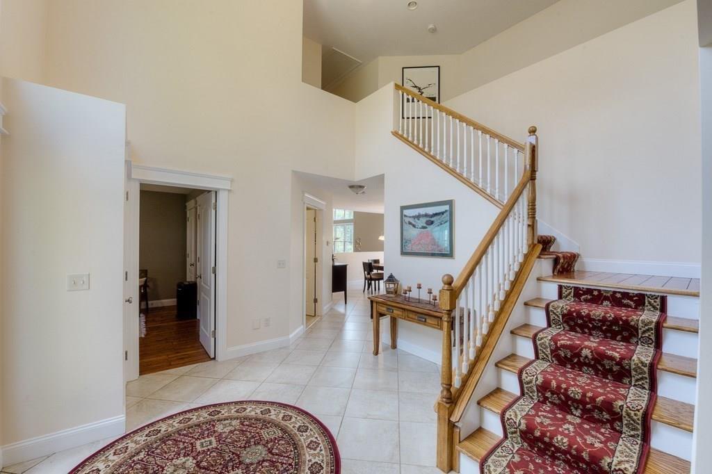 28 Draper Woods Road Sturbridge, MA 01518 - Photo 7 of 41 a view of entryway livingroom and hall with wooden floor