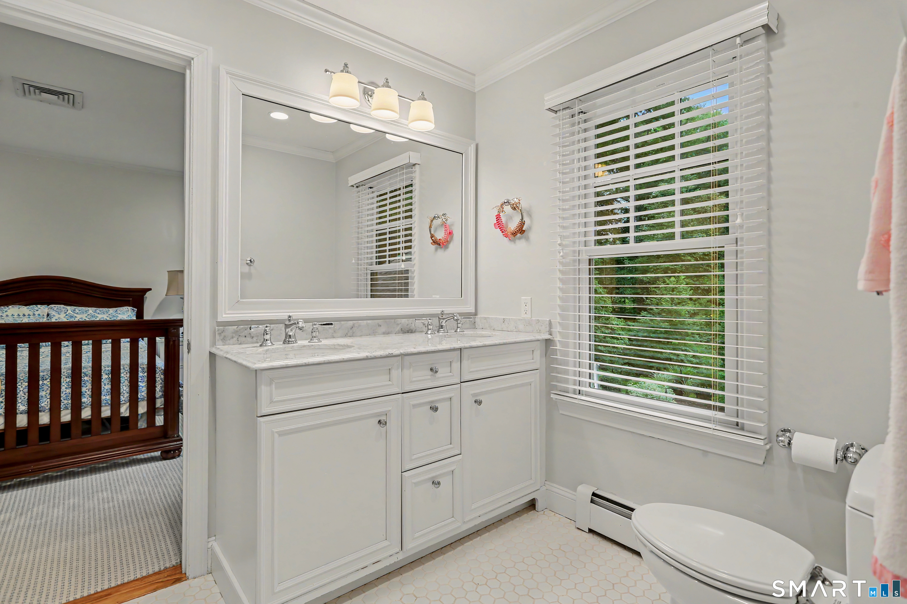108 Logan Road New Canaan, CT 06840 - Photo 29 of 40 a bathroom with a granite countertop sink a toilet and a mirror