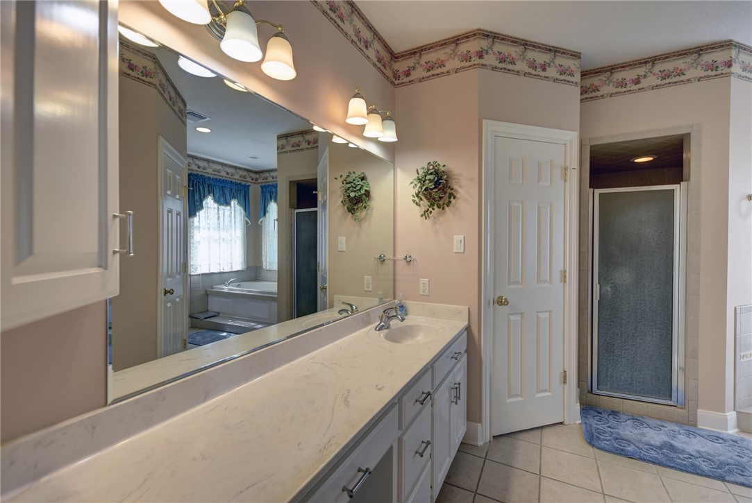 2120 Hohenwalde School Road Brenham, TX 77833 - Photo 13 of 23 a bathroom with a double vanity sink and a mirror