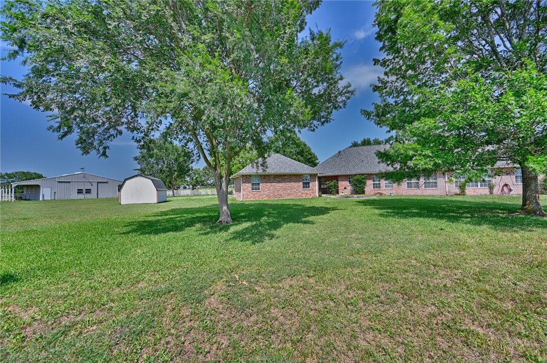 2120 Hohenwalde School Road Brenham, TX 77833 - Photo 6 of 23 a view of a house with a yard