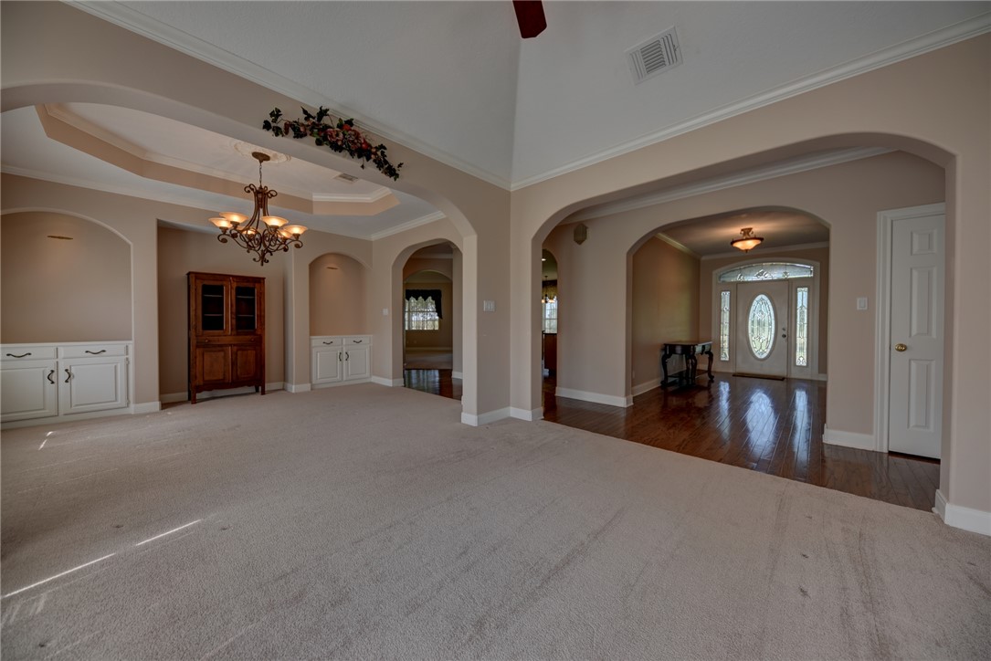 2120 Hohenwalde School Road Brenham, TX 77833 - Photo 10 of 23 a view of a room with chandelier and couches