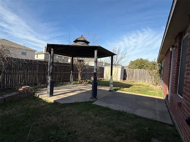 a view of house with yard