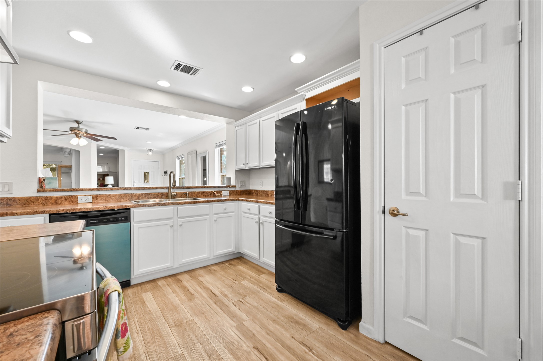 7620 Cayenne Lane Austin, TX 78741 - Photo 14 of 27 a kitchen with stainless steel appliances granite countertop a refrigerator and a sink