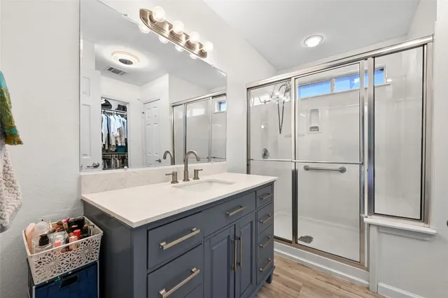 a bathroom with a sink double vanity and a mirror