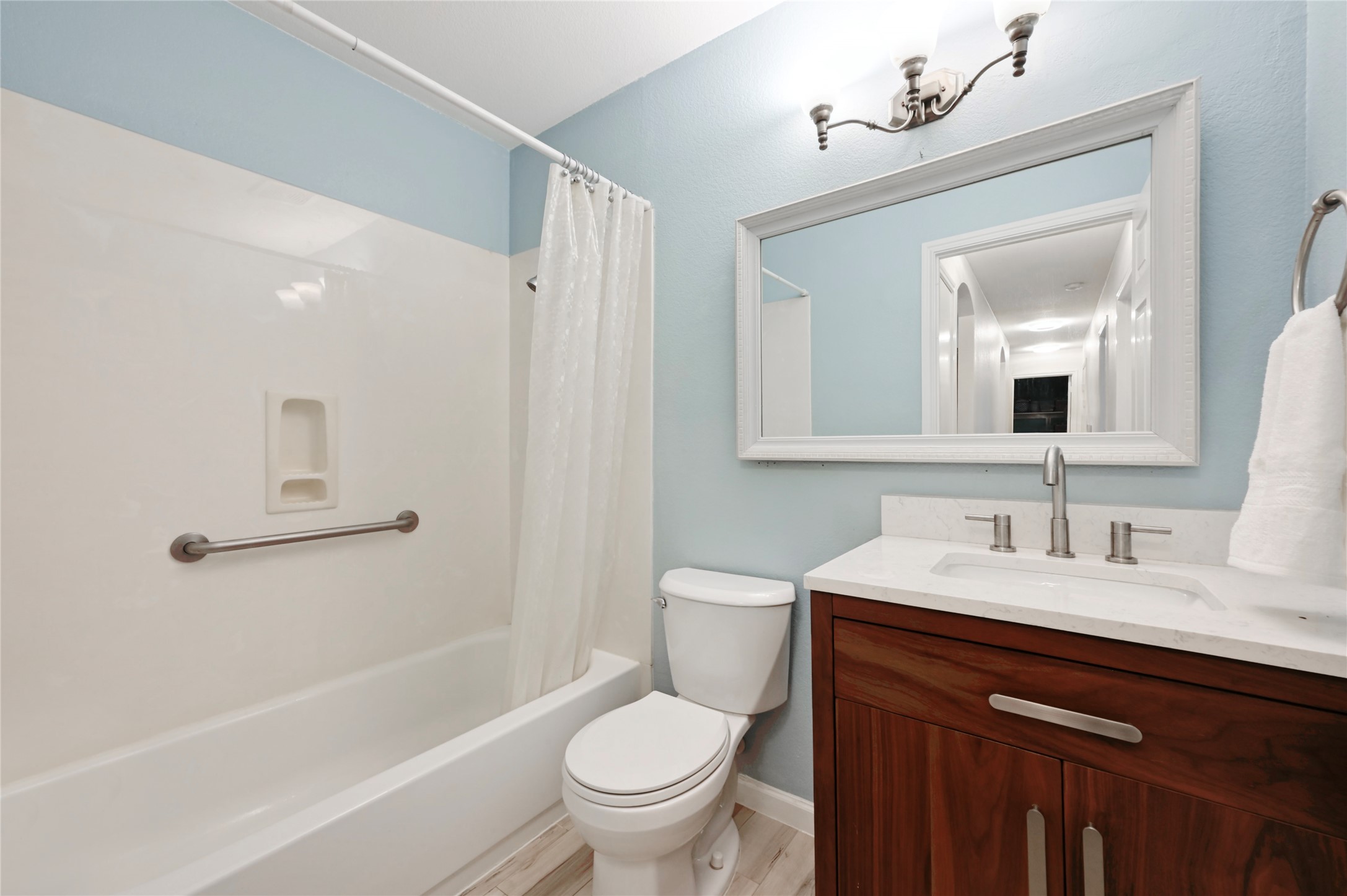 7620 Cayenne Lane Austin, TX 78741 - Photo 22 of 27 a bathroom with a toilet a sink a bathtub and a mirror