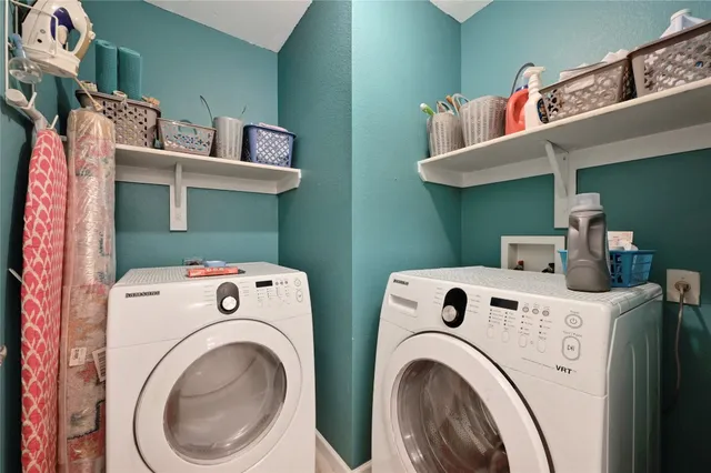 a utility room with dryer and washer