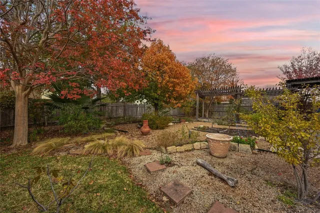 a view of a backyard with sitting area